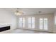 Spacious living room with fireplace, neutral paint, carpet, and windows for natural light at 3157 Peartree Nw Dr, Acworth, GA 30101
