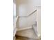 Carpeted stairway with white railing and trim leads to the upper level of the home at 3157 Peartree Nw Dr, Acworth, GA 30101