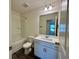 Clean bathroom featuring a shower-tub combo, a single sink vanity, and wood-look flooring at 544 Magnolia Circle, Palmetto, GA 30268