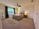 Cozy bedroom featuring a plush bed, ceiling fan, and natural light at 544 Magnolia Circle, Palmetto, GA 30268