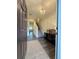 Inviting entryway with wood floors, elegant light fixture, and decor at 544 Magnolia Circle, Palmetto, GA 30268