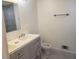 Bathroom with a double sink vanity and gray cabinets at 110 Chippewa Ct, Riverdale, GA 30296