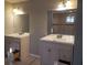 Bathroom with double sink vanity with neutral walls and tiled flooring at 110 Chippewa Ct, Riverdale, GA 30296