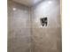 Gray tiled walk-in shower with a tile niche at 110 Chippewa Ct, Riverdale, GA 30296