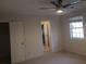 Bedroom with a ceiling fan, window, and a closet at 110 Chippewa Ct, Riverdale, GA 30296