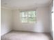 Bright bedroom featuring a large window and neutral color palette at 110 Chippewa Ct, Riverdale, GA 30296