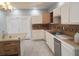 Bright kitchen featuring white cabinets, tiled countertops, and an island with drawers at 110 Chippewa Ct, Riverdale, GA 30296