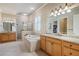 Bright bathroom with dual vanities, soaking tub, and glass enclosed shower at 1549 Lake Holcomb Ln, Marietta, GA 30062