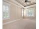 Bedroom features neutral walls, carpeted floors, and windows with shutters at 1549 Lake Holcomb Ln, Marietta, GA 30062