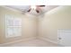 Bedroom with neutral carpet and trim and a window with plantation shutters at 1549 Lake Holcomb Ln, Marietta, GA 30062