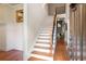 Inviting home foyer featuring hardwood floors, staircase, and a view into the living spaces, creating a warm welcome at 1549 Lake Holcomb Ln, Marietta, GA 30062