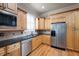 Kitchen boasts granite counters, stainless appliances, and wooden cabinets at 1549 Lake Holcomb Ln, Marietta, GA 30062