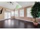 Bright living area with hardwood floors, ceiling fan and large windows at 1549 Lake Holcomb Ln, Marietta, GA 30062