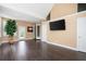 Living area with hardwood floors, high ceilings and a TV at 1549 Lake Holcomb Ln, Marietta, GA 30062