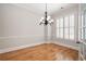 Bright and airy room featuring hardwood floors, white shutters, and a classic chandelier, creating a sophisticated ambiance at 1549 Lake Holcomb Ln, Marietta, GA 30062