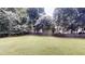 Expansive backyard featuring a well-maintained lawn and a privacy fence, perfect for outdoor activities at 3001 Donamire Nw Ave, Kennesaw, GA 30144