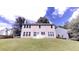 A backyard with green grass, trees, and lots of sun at 3001 Donamire Nw Ave, Kennesaw, GA 30144