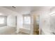 Bathroom with a soaking tub, and a door leading to the next room at 3001 Donamire Nw Ave, Kennesaw, GA 30144
