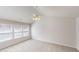 Vaulted ceiling bedroom with a ceiling fan, and three light-filled windows at 3001 Donamire Nw Ave, Kennesaw, GA 30144