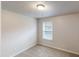 Cozy bedroom with natural light and neutral carpet flooring at 3001 Donamire Nw Ave, Kennesaw, GA 30144