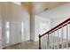 Bright entryway with wood-look flooring, a white front door, and a staircase with wood handrail at 3001 Donamire Nw Ave, Kennesaw, GA 30144