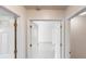 Hallway leads to a bedroom with white doors at 3001 Donamire Nw Ave, Kennesaw, GA 30144
