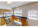 Well-lit kitchen featuring stainless steel appliances, wood cabinets, and an island at 3001 Donamire Nw Ave, Kennesaw, GA 30144