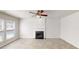 Bright living room with fireplace, ceiling fan, and wood flooring at 3001 Donamire Nw Ave, Kennesaw, GA 30144