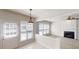 Bright living room boasts natural light, a fireplace, and a ceiling fan at 3001 Donamire Nw Ave, Kennesaw, GA 30144