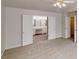 Spacious main bedroom with doorway to the ensuite bathroom at 3001 Donamire Nw Ave, Kennesaw, GA 30144
