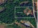 Beautiful 2.93 acre wooded lot with a traditional home with side-entry garage on John Rivers Rd in Dallas, GA at 6945 John Rivers Rd, Fairburn, GA 30213