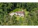 Aerial view showcases the house with long driveway and surrounding landscape, providing privacy and serene living at 6945 John Rivers Rd, Fairburn, GA 30213