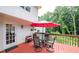 Outdoor dining table and seating, and a beautiful treed yard at 6945 John Rivers Rd, Fairburn, GA 30213