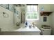 Bathroom with a vanity, a framed mirror, a window and decor at 6945 John Rivers Rd, Fairburn, GA 30213