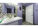 Stylish bathroom featuring a vanity with modern fixtures and a decorative mirror at 6945 John Rivers Rd, Fairburn, GA 30213