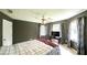 Comfortable bedroom featuring a ceiling fan and bright natural light at 6945 John Rivers Rd, Fairburn, GA 30213
