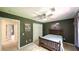 Bedroom featuring neutral decor featuring a bed with a headboard and an area rug at 6945 John Rivers Rd, Fairburn, GA 30213