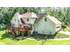 The rear of this home has a large deck, stairs down to a lawn and a fenced-in area for outdoor enjoyment at 6945 John Rivers Rd, Fairburn, GA 30213