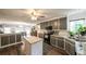 Bright kitchen with an island, gray cabinets, hardwood floors, and breakfast nook at 6945 John Rivers Rd, Fairburn, GA 30213