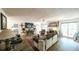 Spacious living room with hardwood floors, fireplace, and large windows providing ample natural light at 6945 John Rivers Rd, Fairburn, GA 30213