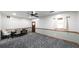 This living room has gray patterned floors, a window, and a ceiling fan at 6945 John Rivers Rd, Fairburn, GA 30213
