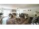 Spacious living room with a cozy fireplace, plush furniture, and lots of space for entertaining at 6945 John Rivers Rd, Fairburn, GA 30213