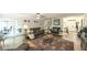 Spacious living area featuring hardwood floors, comfortable seating, and ample natural light at 6945 John Rivers Rd, Fairburn, GA 30213