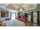 Bedroom with a tray ceiling, recessed lighting, and windows providing plenty of natural light at 6945 John Rivers Rd, Fairburn, GA 30213