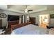 Spacious bedroom with tray ceiling and access to ensuite bathroom at 6945 John Rivers Rd, Fairburn, GA 30213