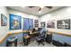 This office has blue accent walls with Star Wars decor and a desk with a gaming computer at 6945 John Rivers Rd, Fairburn, GA 30213