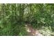 A nature trail provides residents with direct access to outdoor activities and enjoyment of the natural surroundings at 6945 John Rivers Rd, Fairburn, GA 30213