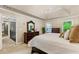 Relaxing primary bedroom boasts a neutral palette, trey ceiling, and view into the hall at 910 Kings Arms Way, Johns Creek, GA 30022