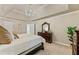 Bright primary bedroom with ensuite bathroom, neutral colors, trey ceiling, and stylish decor at 910 Kings Arms Way, Johns Creek, GA 30022