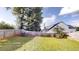Spacious backyard featuring a well-maintained lawn and wooden fence at 1001 Balsam Wood Trl, Villa Rica, GA 30180